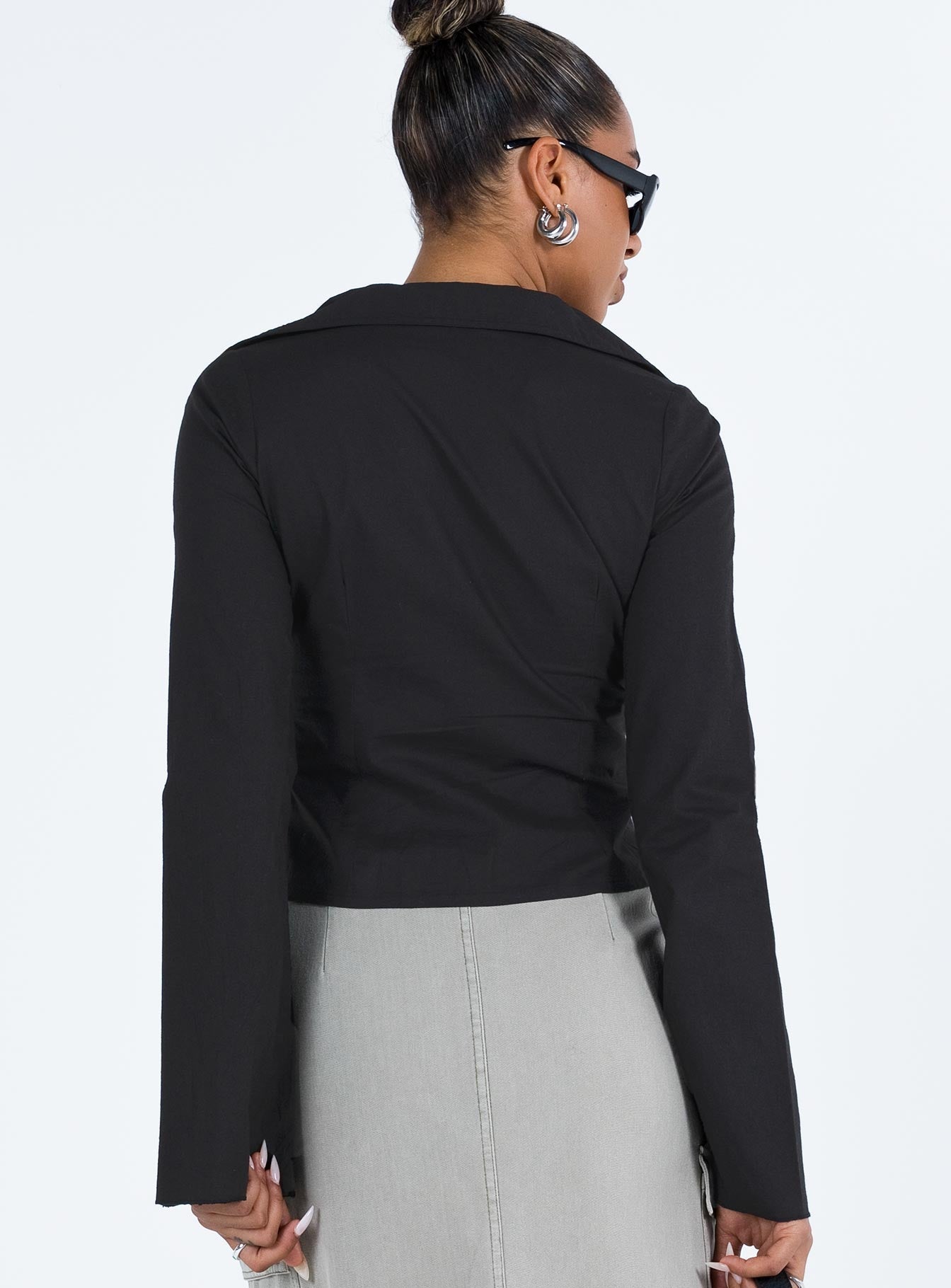 Shirt V neckline Classic collar Slight ruching at bust Button fastening at front Knitted lace detail Flared cuff