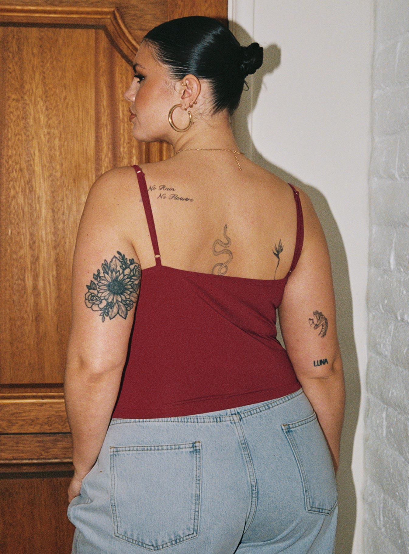 back view of model wearing Princess Polly Sampson Top Burgundy Curve Sleeveless Plunger 