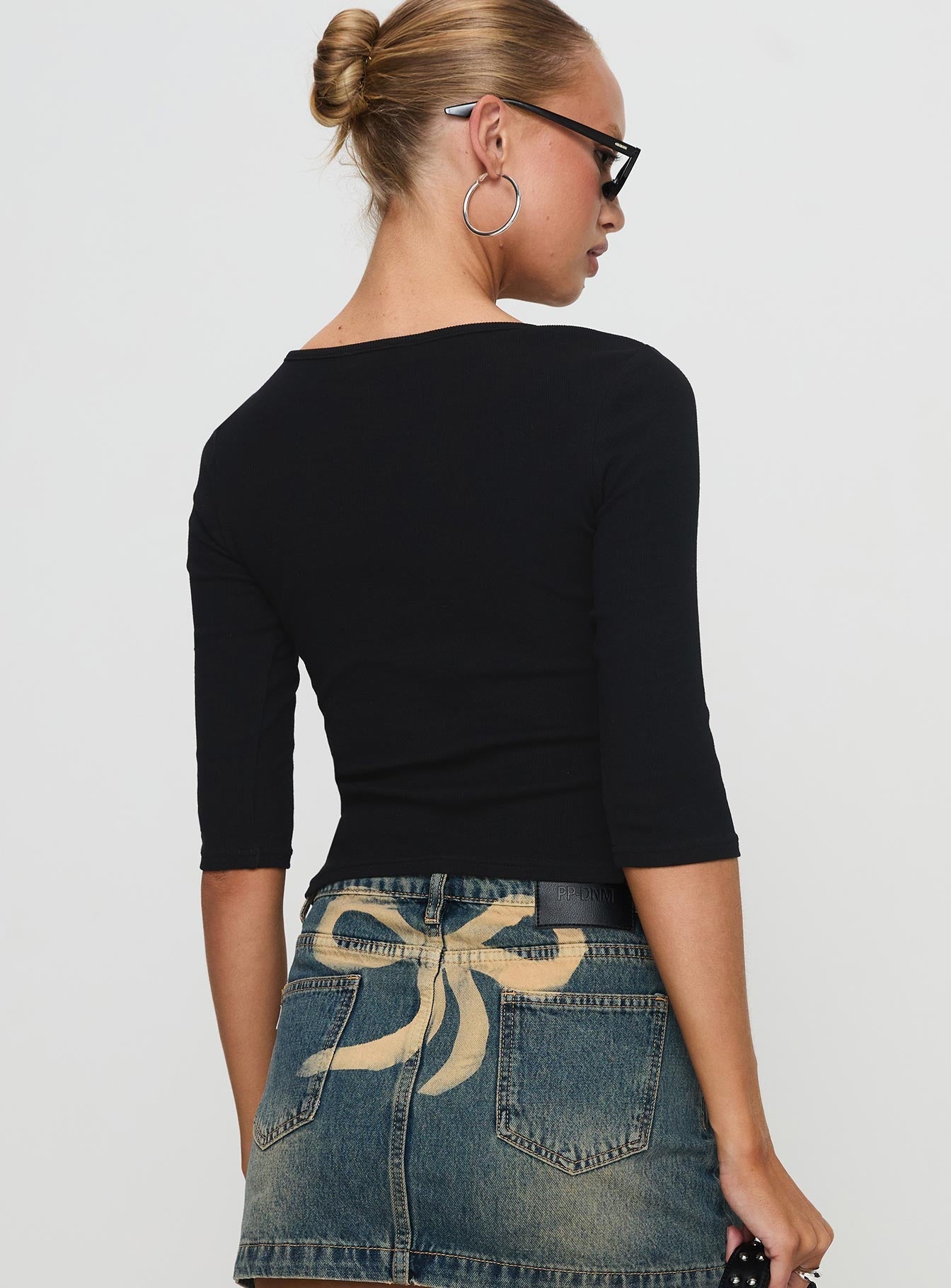 back view of model wearing Princess Polly Elaia 3/4 Sleeve Top Black Three Fourth Sleeves Crew Neck 