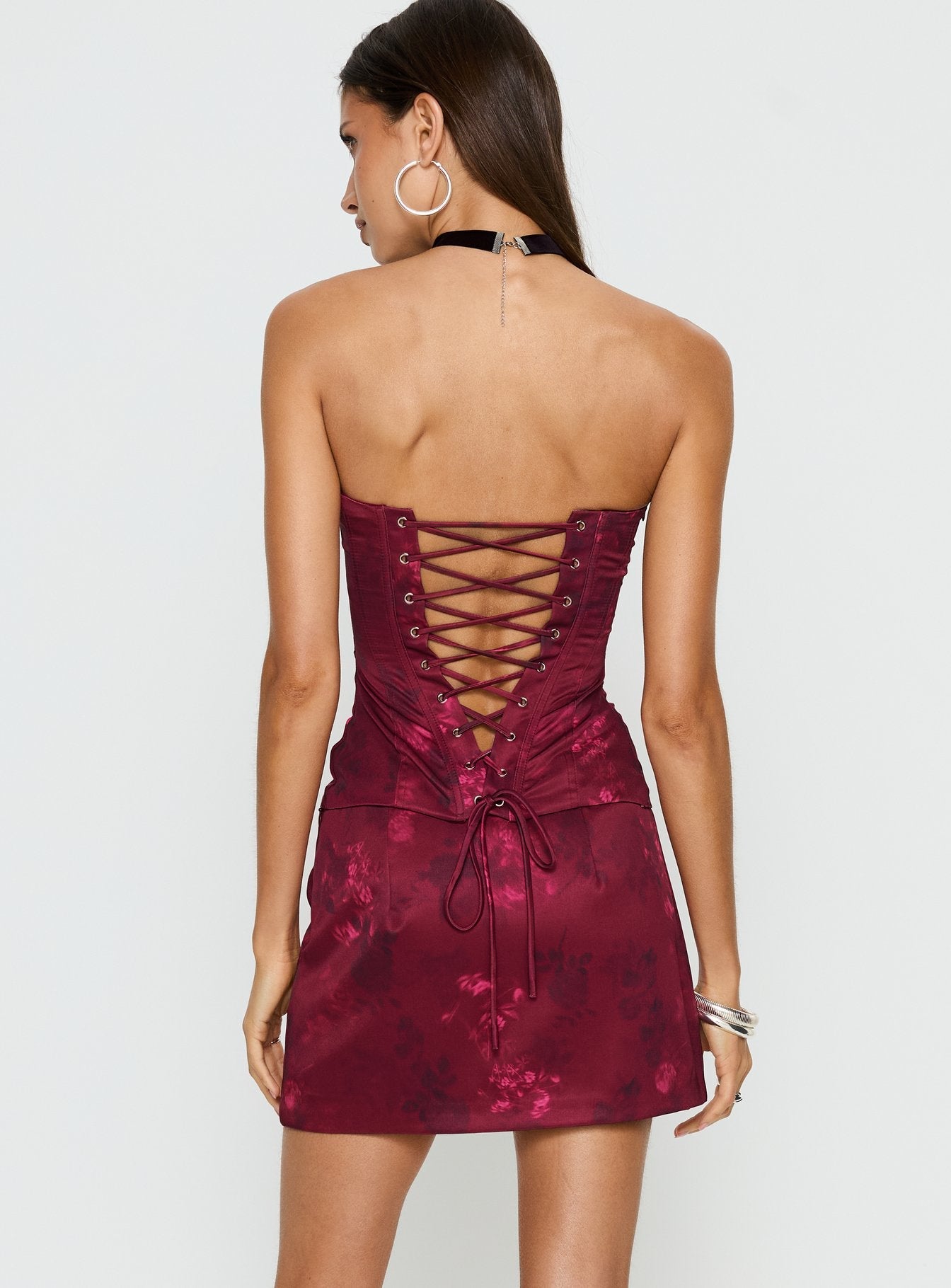back view of model wearing Princess Polly Lovesita Bow Mini Skirt Red Floral Mini Skirts 