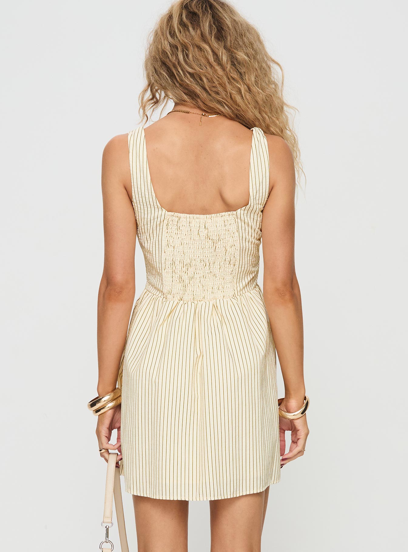 back view of model wearing Princess Polly Phillipson Mini Dress Beige Stripe Square Neck 