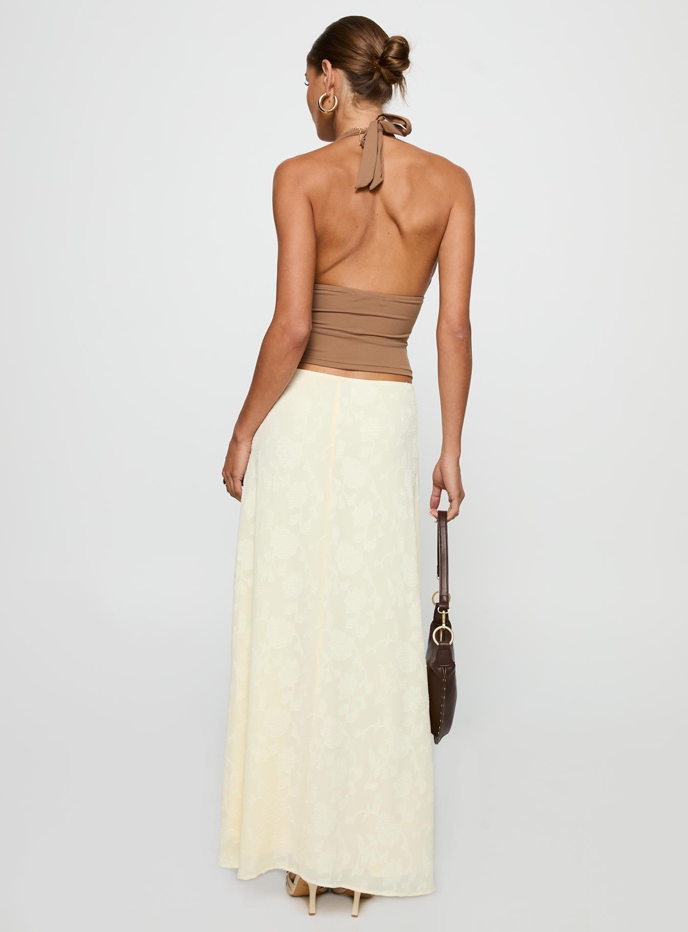 back view of model wearing Princess Polly Su Casa Low Waist Maxi Skirt Yellow Maxi 