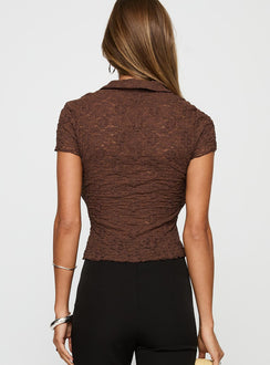 back view of model wearing Princess Polly Best Shot Collared Top Brown Short Sleeves V-Neck 