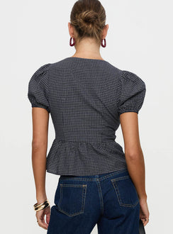 back view of model wearing Princess Polly Verah Tie Up Puff Sleeve Top Navy Check Short Sleeves Scoop Neck 