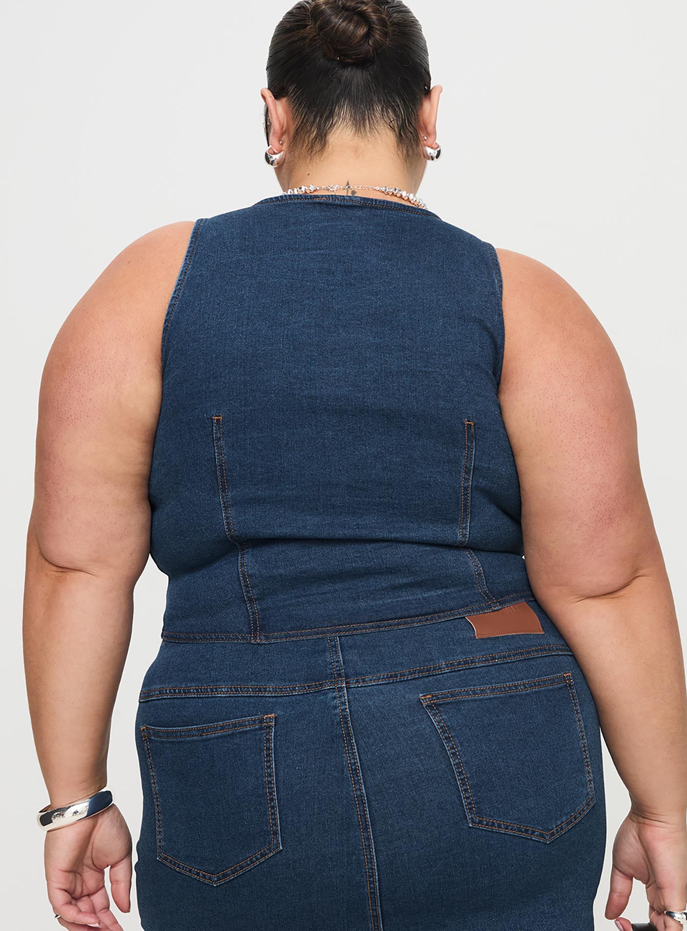 back view of model wearing Princess Polly Edenette Top Mid Blue Wash Curve Sleeveless Plunger 