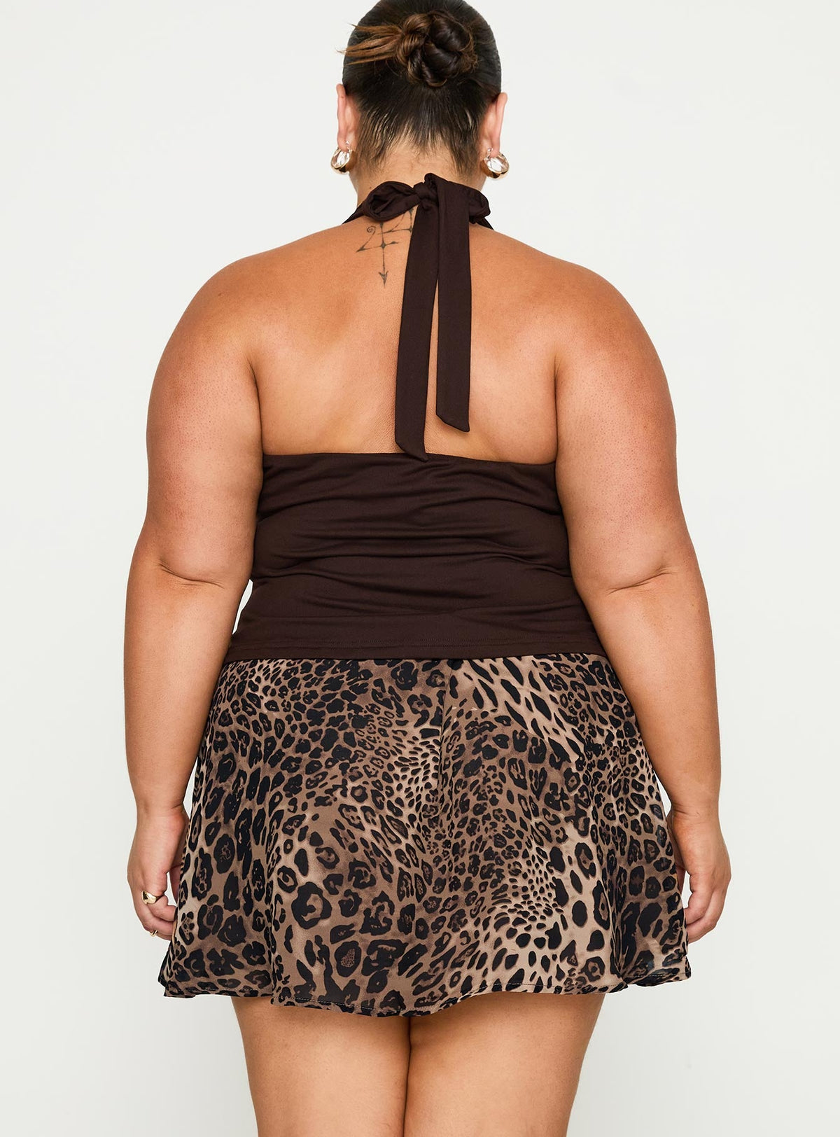 back view of model wearing Princess Polly Tejano Mini Skirt Leopard Curve Mini Skirts Skirts 