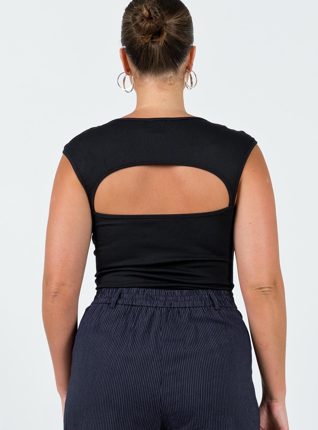 back view of model wearing Princess Polly Halia Bodysuit Black Short Sleeves 