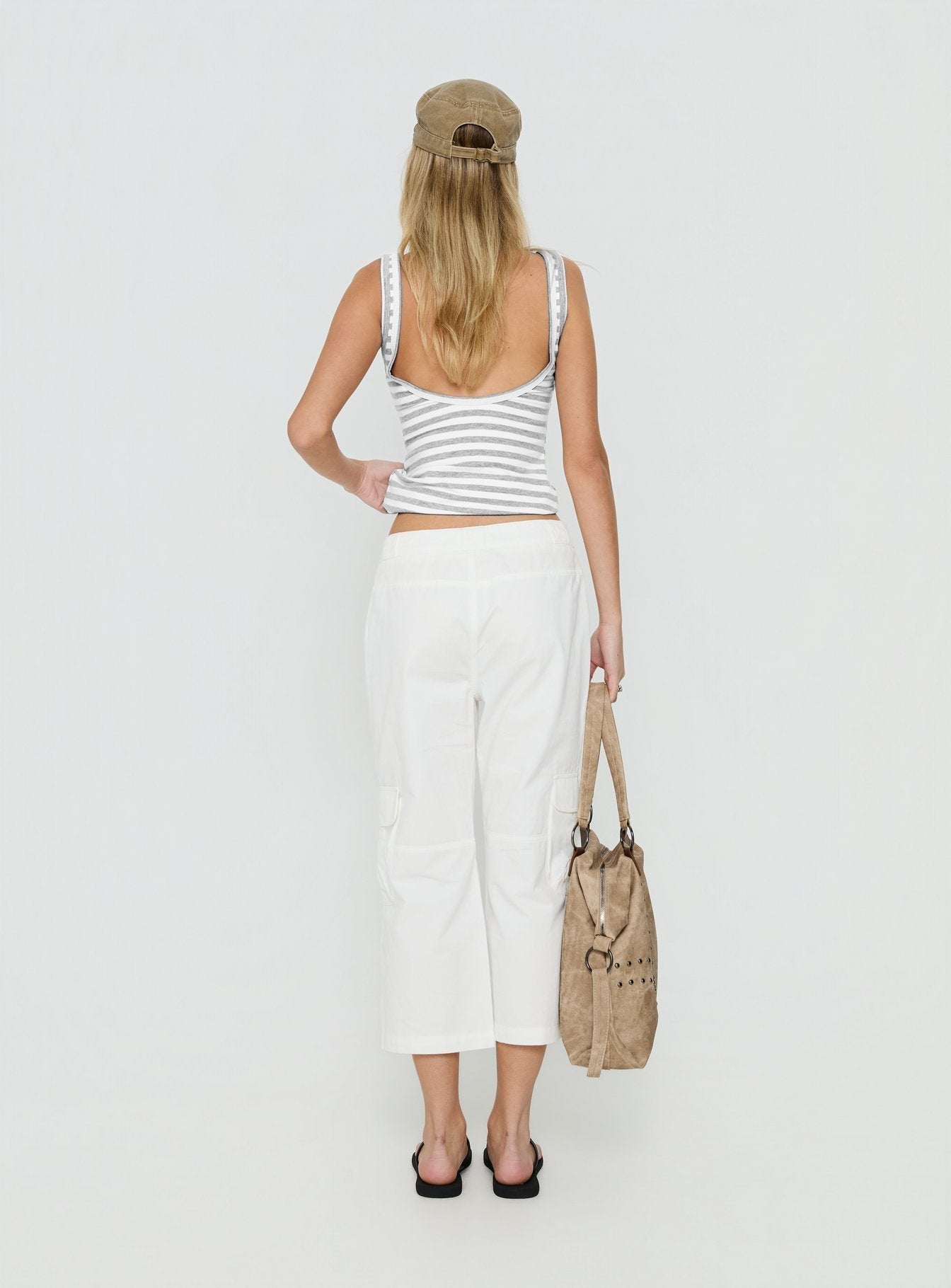 Featuring the Indee Cropped Cargo Pants White womens-regular-pants with high-rise back view of model wearing Princess Polly
