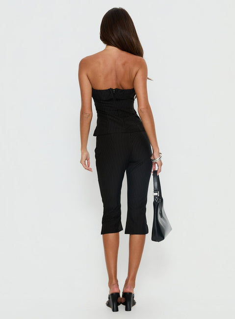 back view of model wearing Princess Polly Isalyn Tailored Capri Pants Black Pinstripe High Rise Pants 