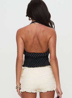 back view of model wearing Princess Polly Brat Halter Top Onyx Polka Sleeveless V-Neck 