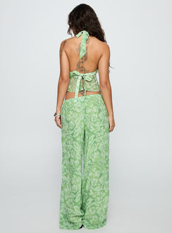 back view of model wearing Princess Polly Finesse Pants Green Floral High Waisted Pants 
