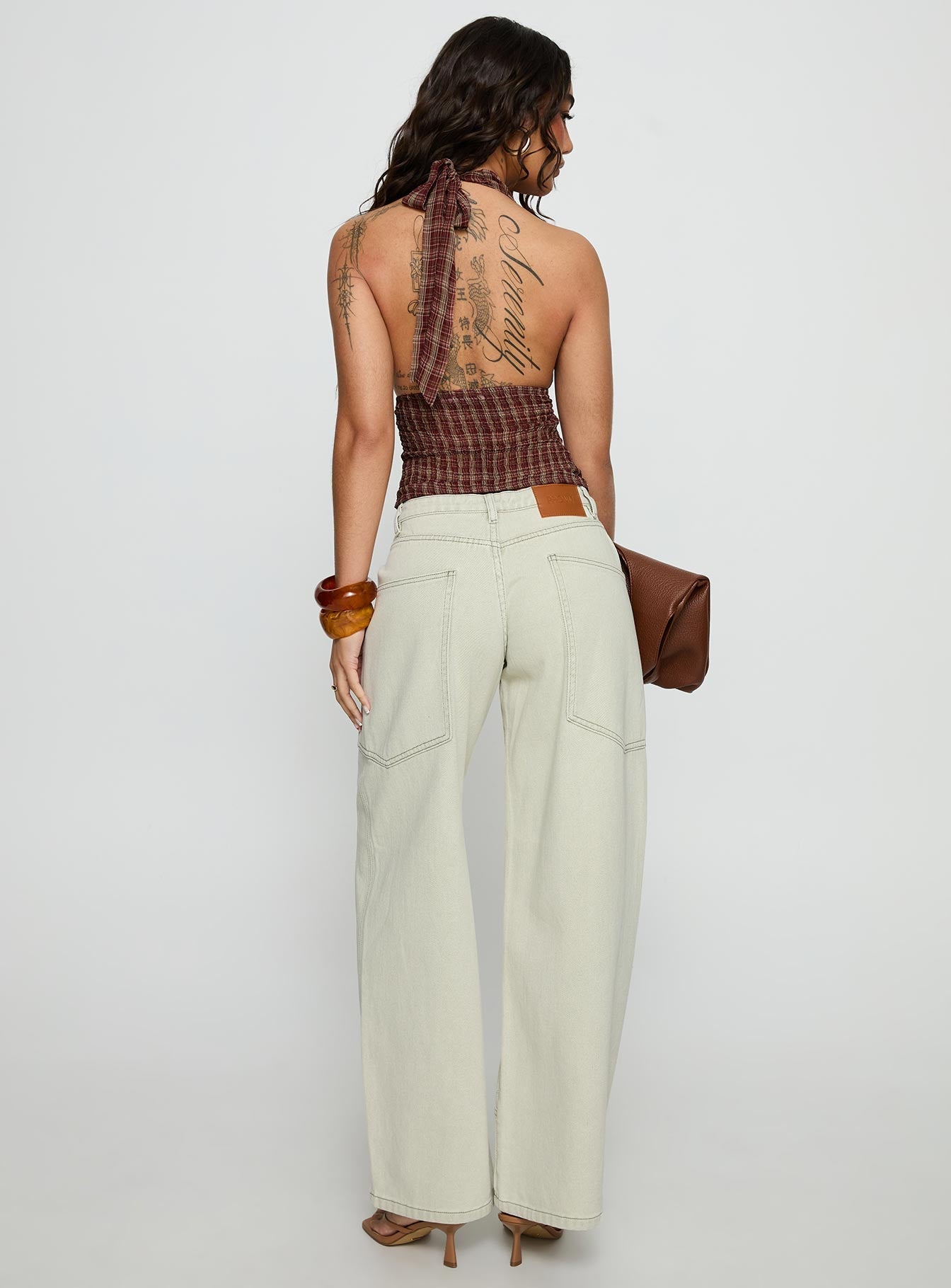 back view of model wearing Princess Polly Amargo Baggy Leg Stitch Detail Denim Jeans Sage Wash Mid Rise Jeans 