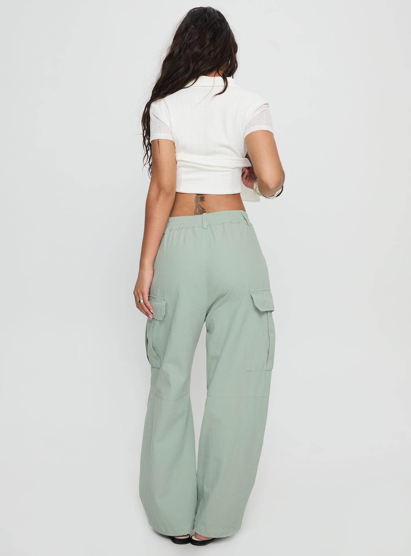 back view of model wearing Princess Polly Elanthea Cargo Pants Green High Waisted Pants 