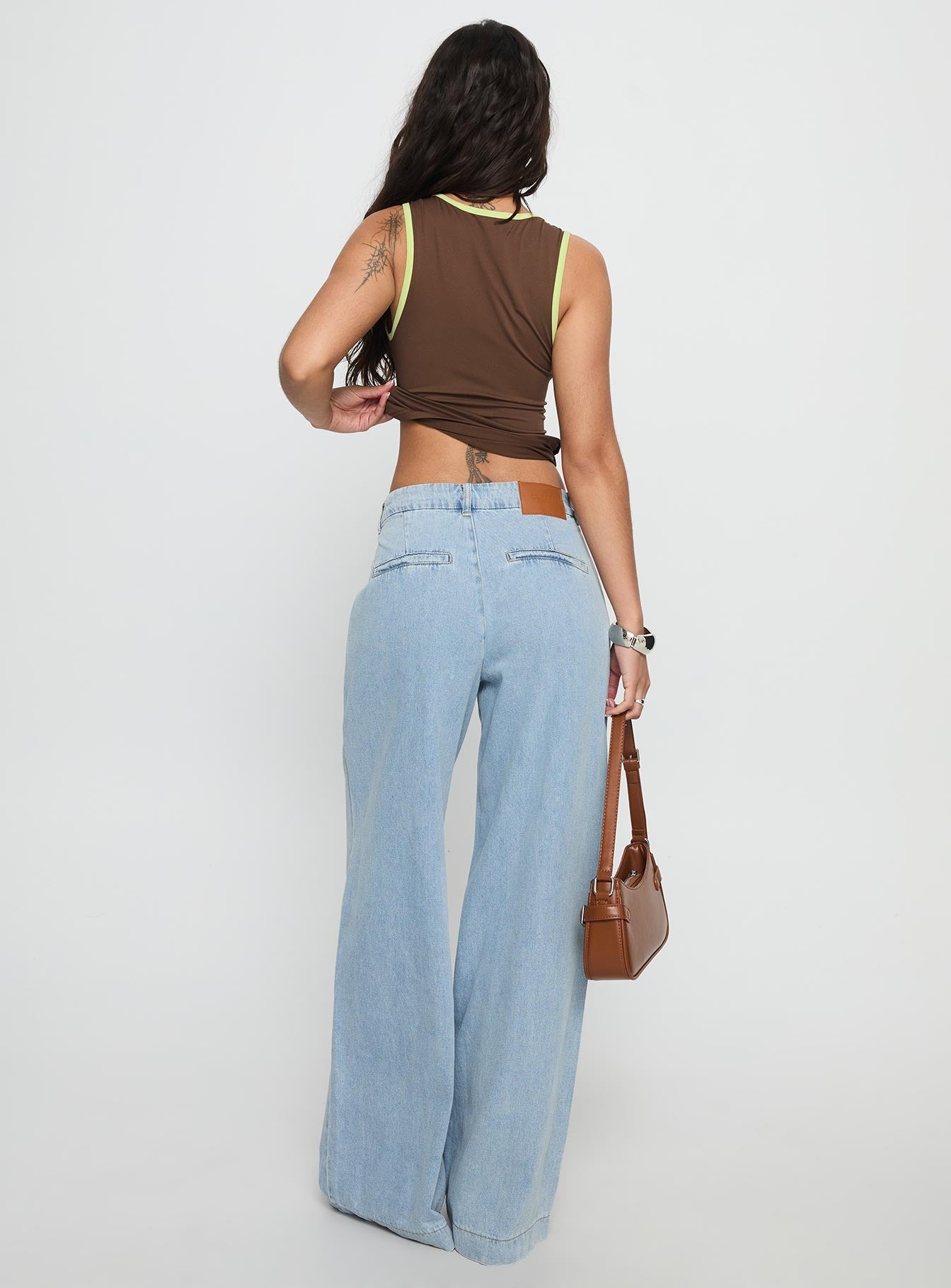 back view of model wearing Princess Polly Siloh Wide Leg Denim Jeans Blue Mid Rise Jeans 