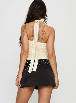 back view of model wearing Princess Polly Savour it Contrast Mini Skirt Black / Polka Dot Mini Skirts 