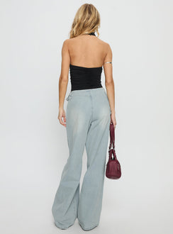 back view of model wearing Princess Polly Paltrow Mid Rise Wide Leg Cargo Jeans Faded Blue Wash Mid Rise Jeans 