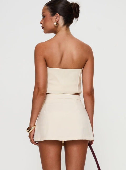 back view of model wearing Princess Polly Full Disclosure Skort Cream High Waisted Shorts 