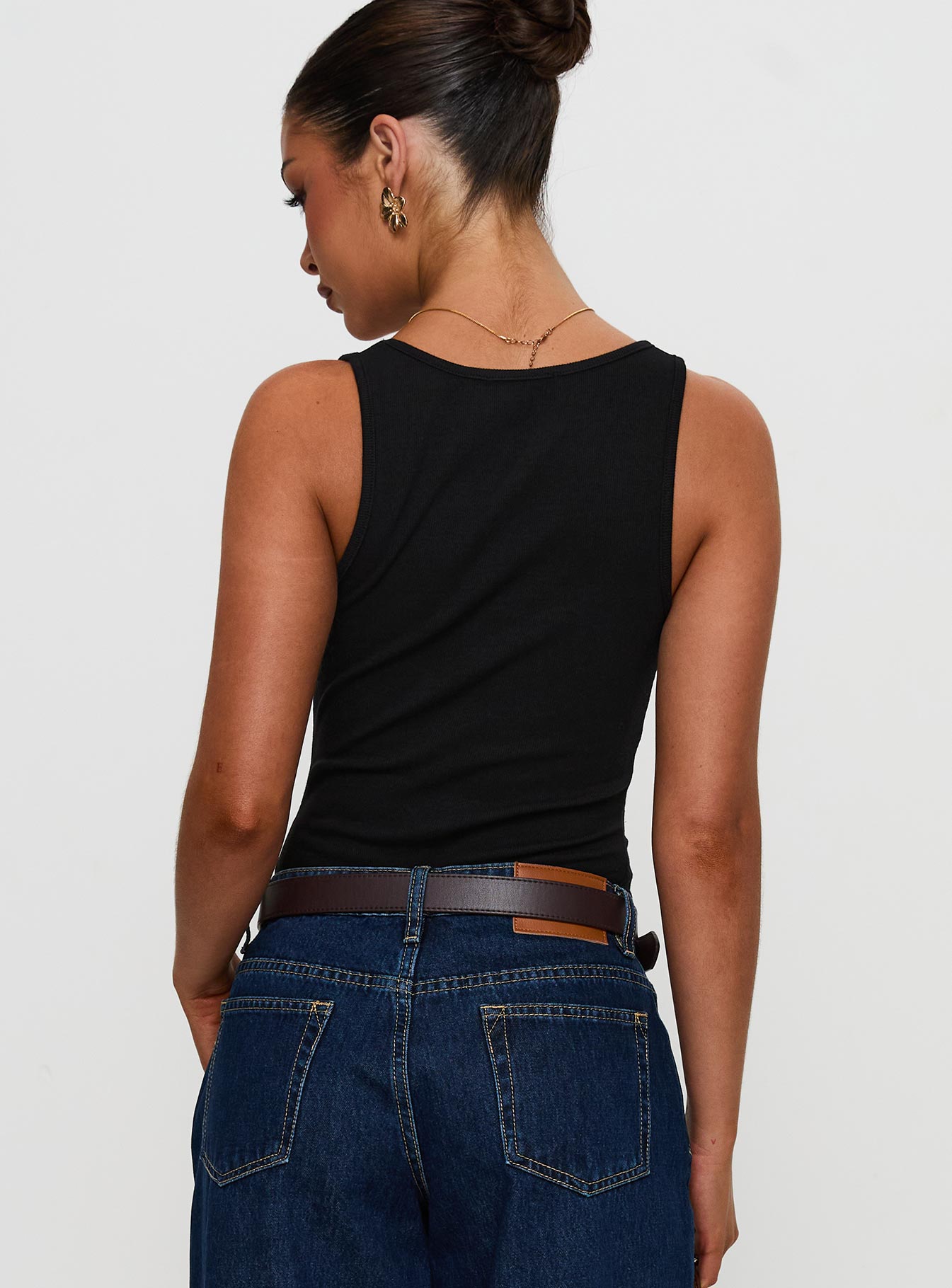 back view of model wearing Princess Polly Baseline Rib Bodysuit Black Sleeveless 