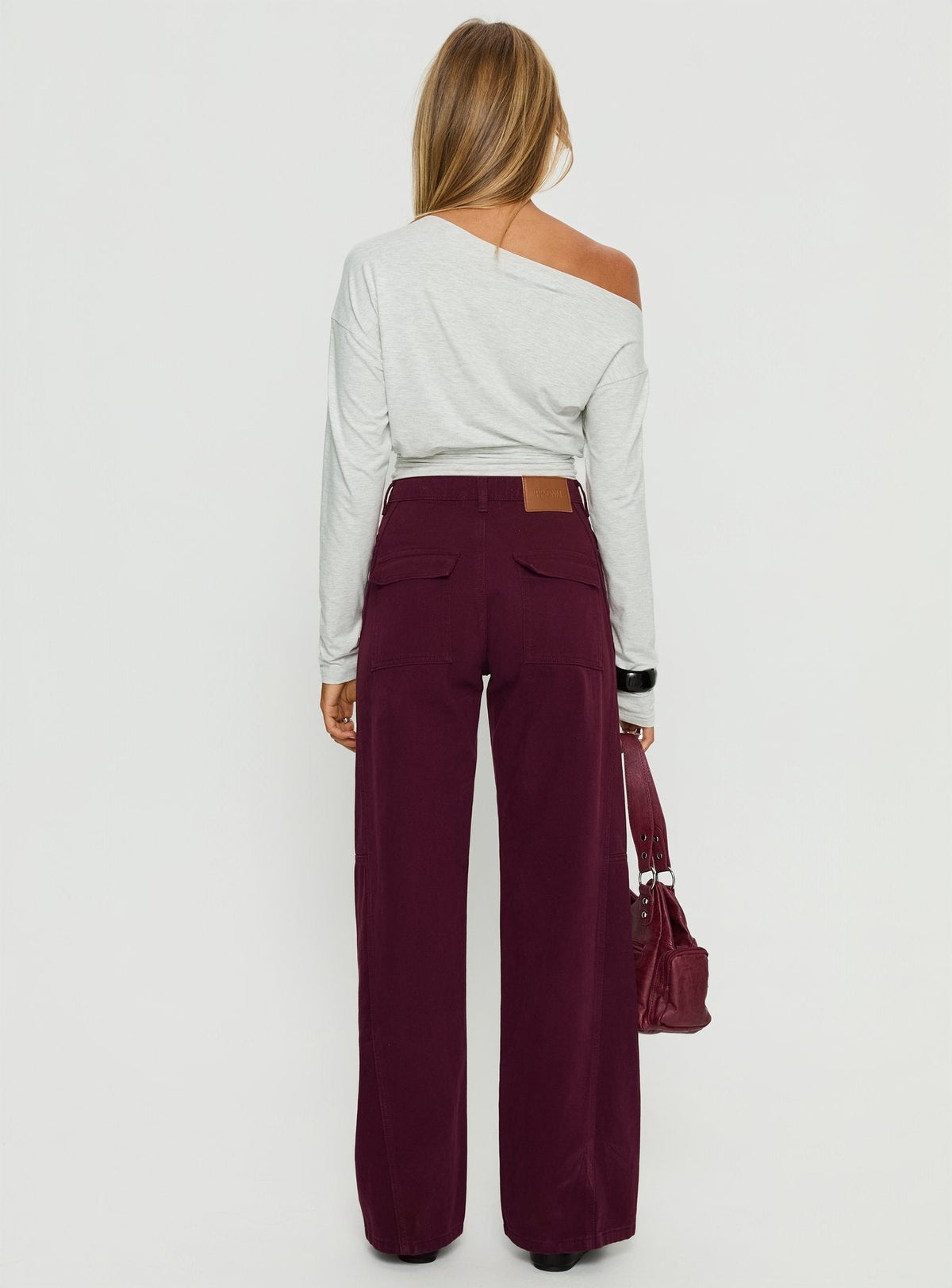 back view of model wearing Princess Polly Bruiser Tie Waist Mid Rise Wide Leg Jeans Currant High Rise Jeans Jeans 