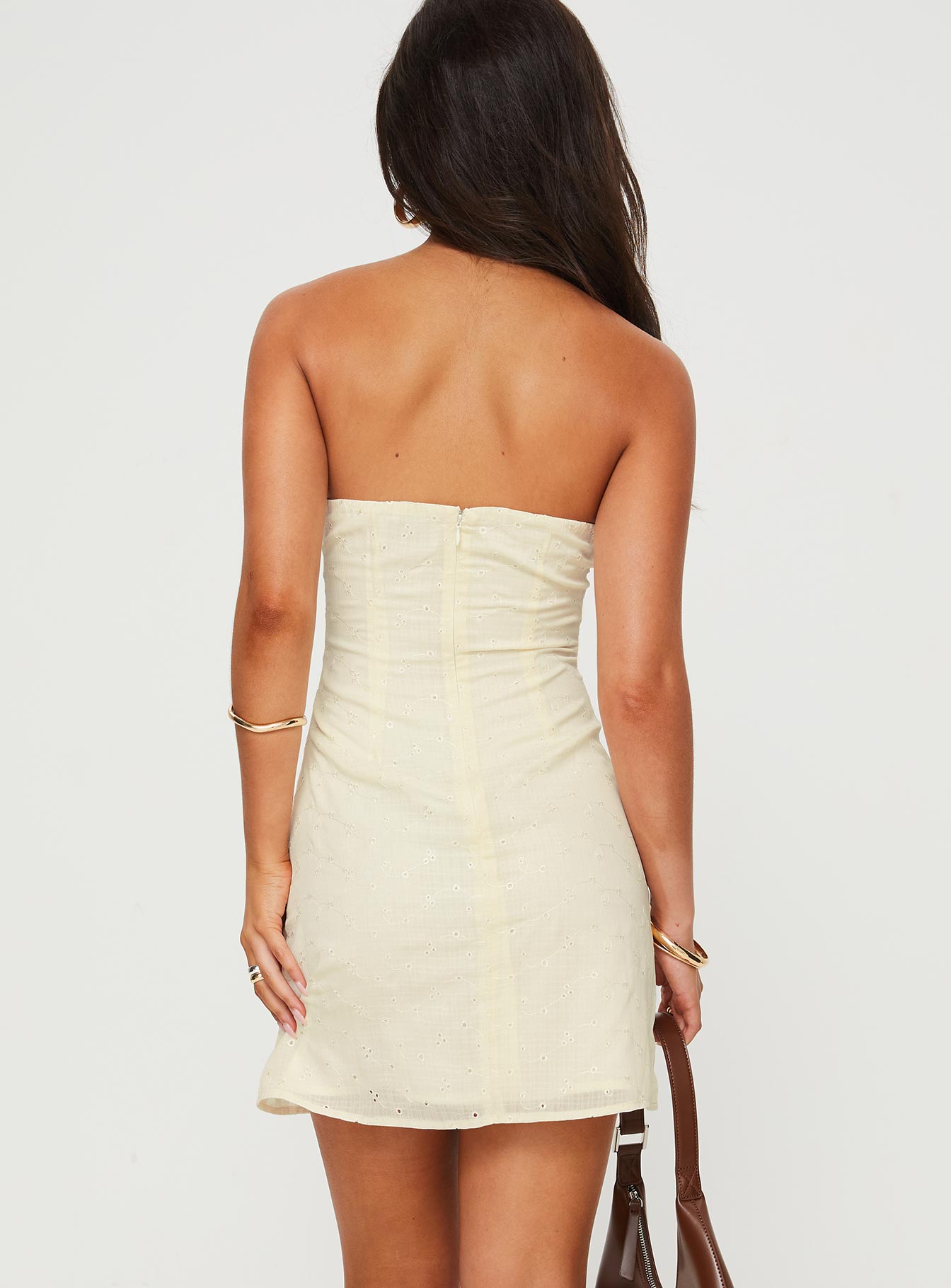 back view of model wearing Princess Polly Malena Strapless Mini Dress Lemon Sweetheart Neckline 