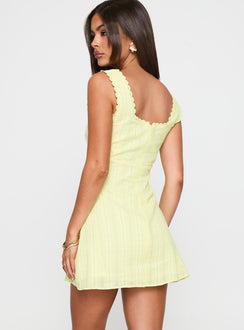 back view of model wearing Princess Polly Dasha Mini Dress Lemon Square Neck 