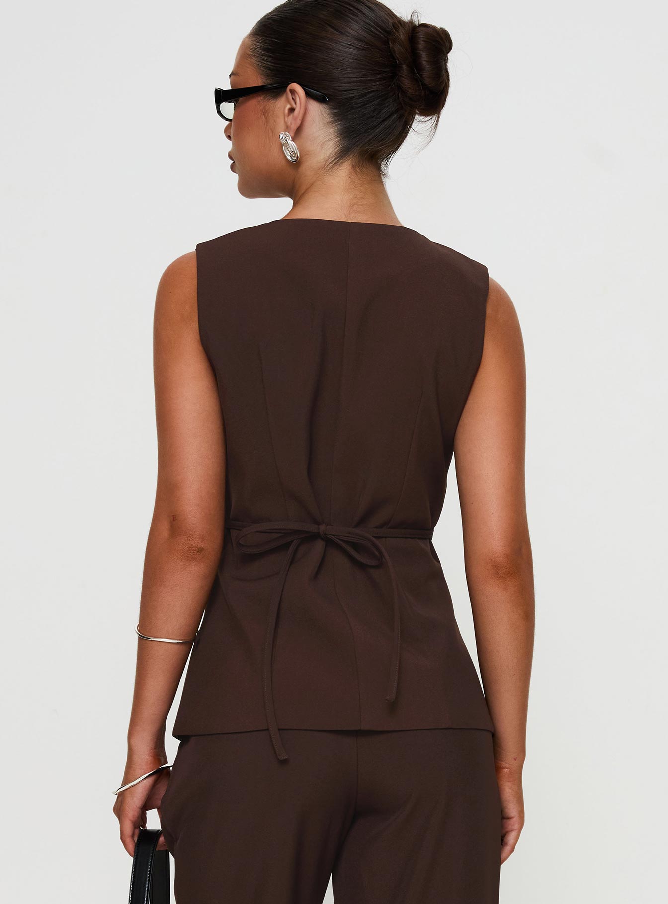 back view of model wearing Princess Polly Ambient Longline Button Up Top Chocolate Sleeveless V-Neck 