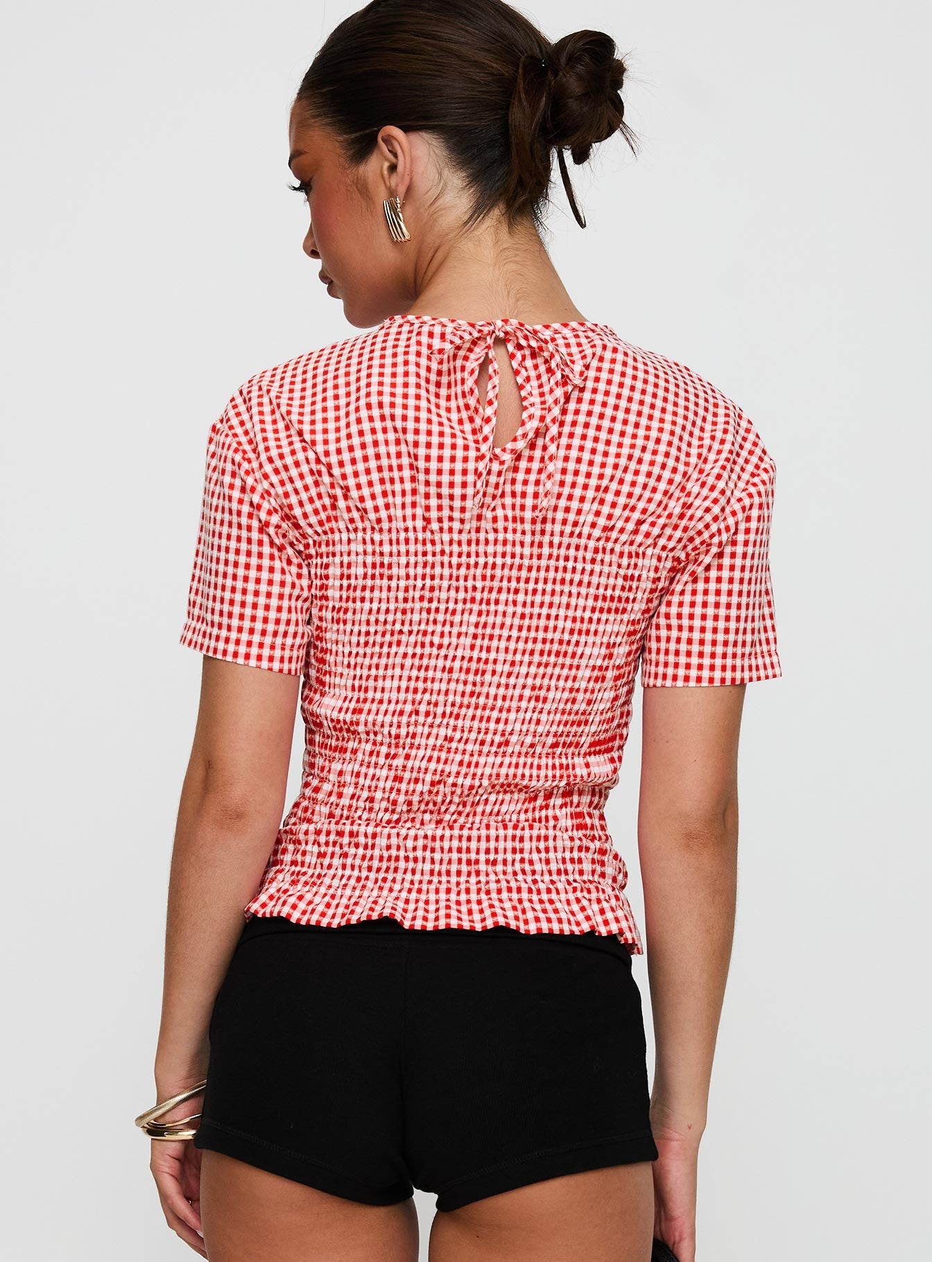 back view of model wearing Princess Polly Maybe Tomorrow Ruched Top Red Check Short Sleeves High Neck 