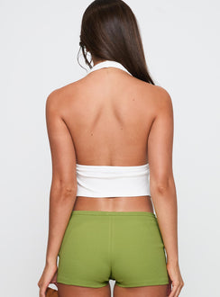 back view of model wearing Princess Polly Obviously Halter Top White Sleeveless Plunger 
