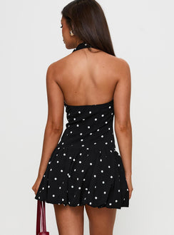 back view of model wearing Princess Polly Gigli Bubble Hem Mini Dress Polka Dot Square Neck 