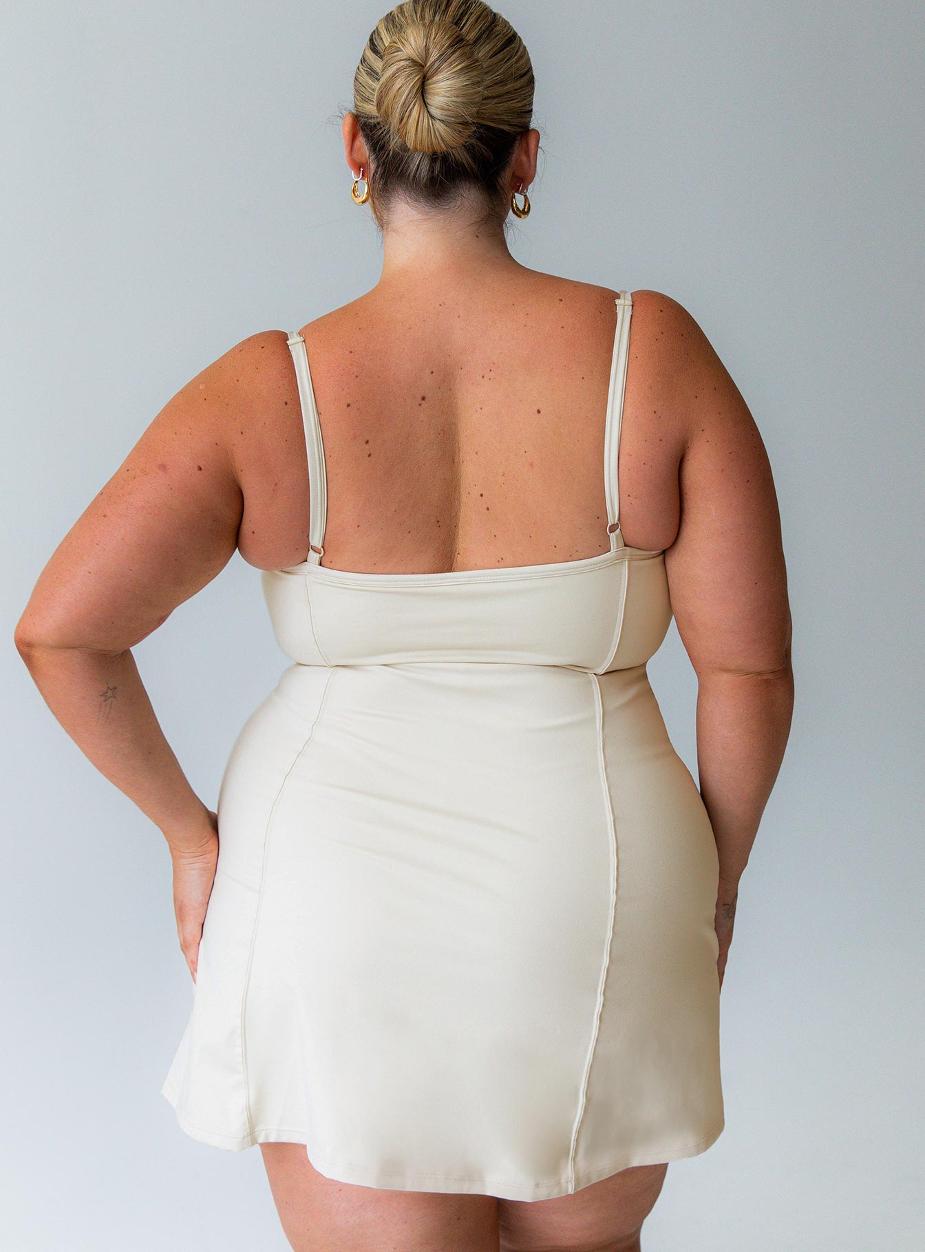 Beige activewear dress flattering scoop-neck shape that feels comfortable and unrestrictive built in shorts