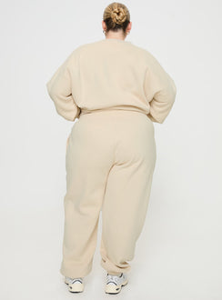 back view of model wearing Princess Polly Princess Polly Track Pants Block / Cursive Text Stone Curve High Waisted Pants 