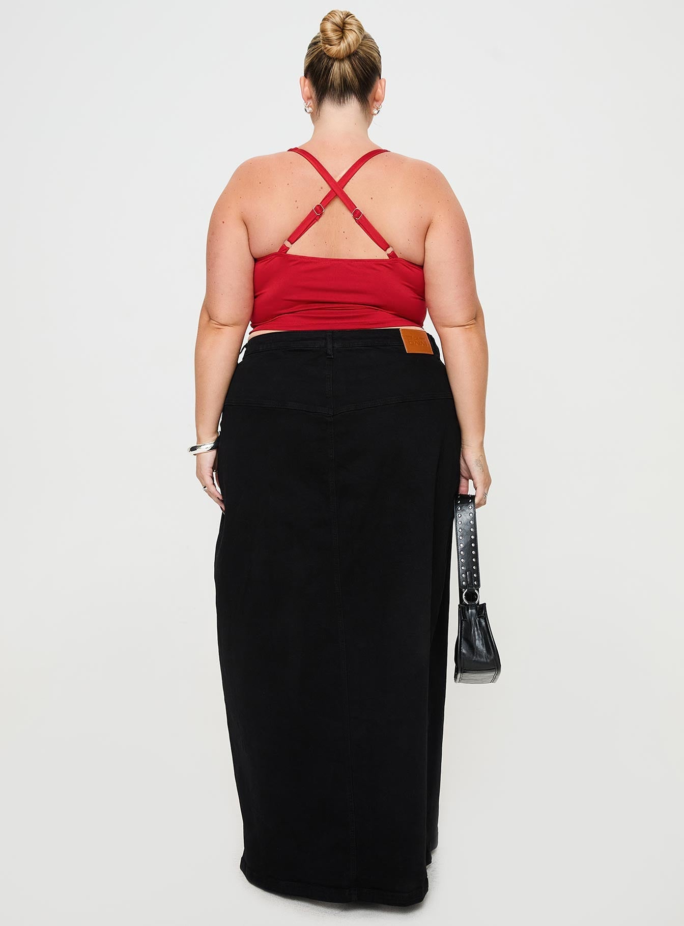 back view of model wearing Princess Polly Batkins Maxi Skirt Black Curve Maxi 