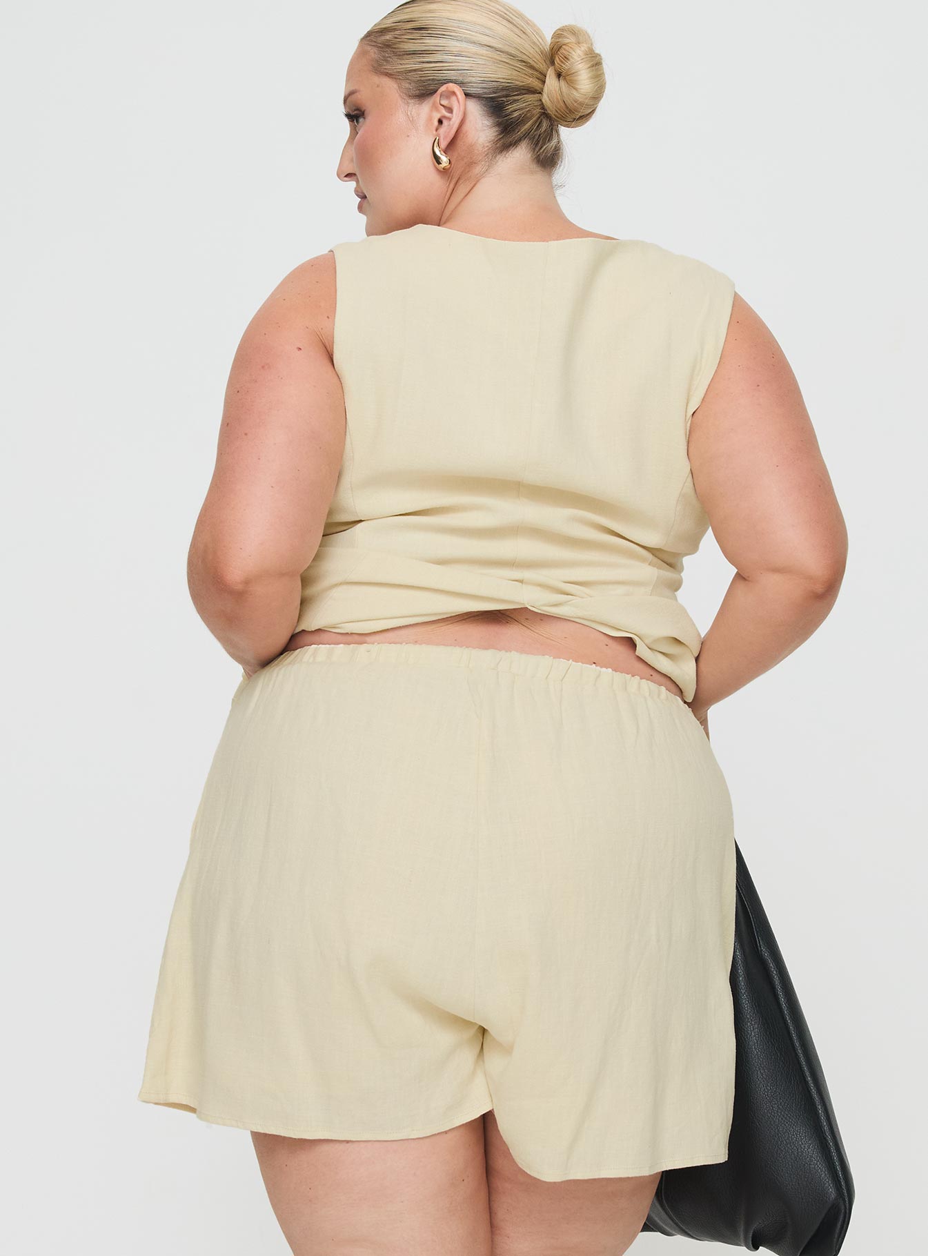 back view of model wearing Princess Polly This Summer Linen Blend Shorts Sand Curve High Waisted Shorts 