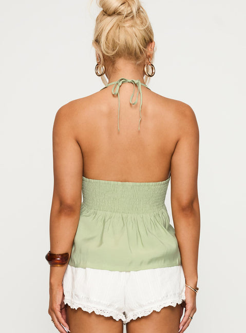 back view of model wearing Princess Polly Gadot Halter Top Green Sleeveless Plunger 