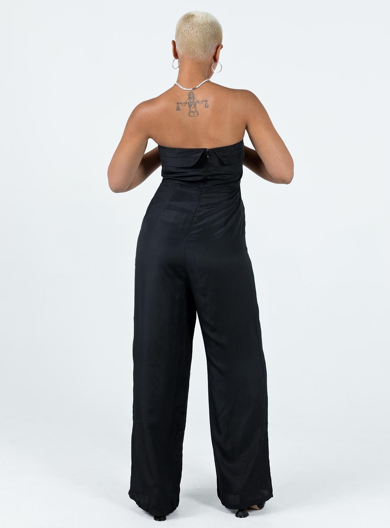 Strapless jumpsuit Folded neckline Inner silicone strip at bust Invisible zip fastening at back