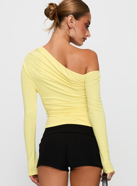 back view of model wearing Princess Polly Beller Long Sleeve Top Lemon Full Sleeves Asymmetric Neckline 