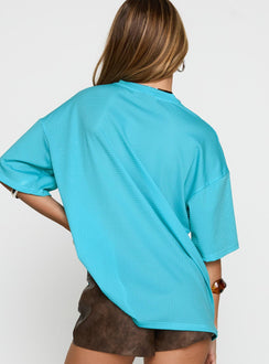 back view of model wearing Princess Polly 98 Sports Graphic Top Blue Half Sleeves V-Neck 