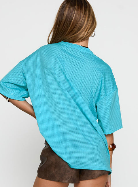 back view of model wearing Princess Polly 98 Sports Graphic Top Blue Half Sleeves V-Neck 