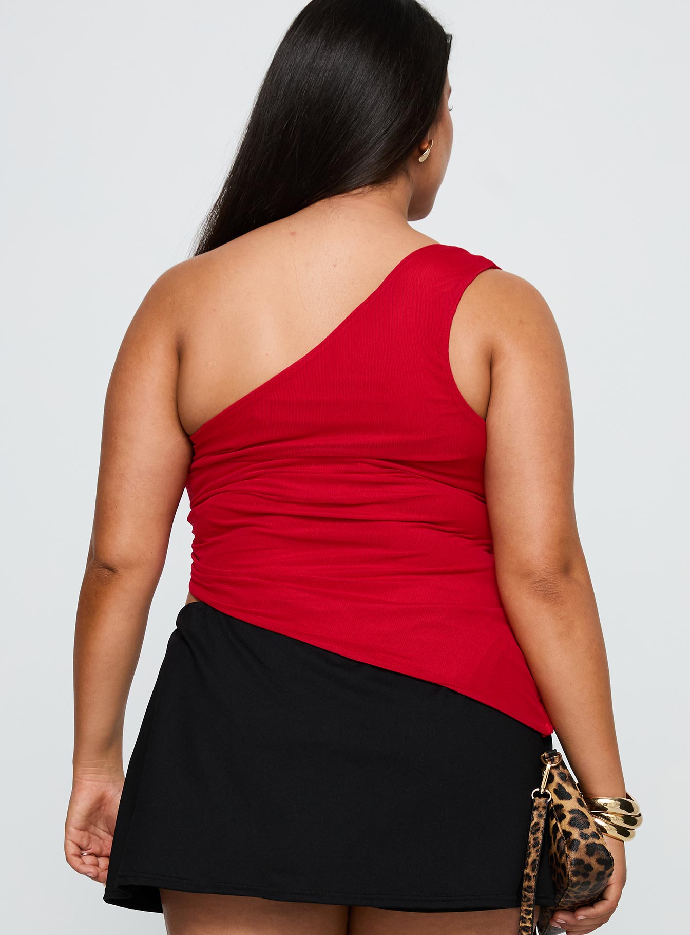 back view of model wearing Princess Polly Machiatto One Shoulder Top Red Curve Sleeveless Asymmetric Neckline 