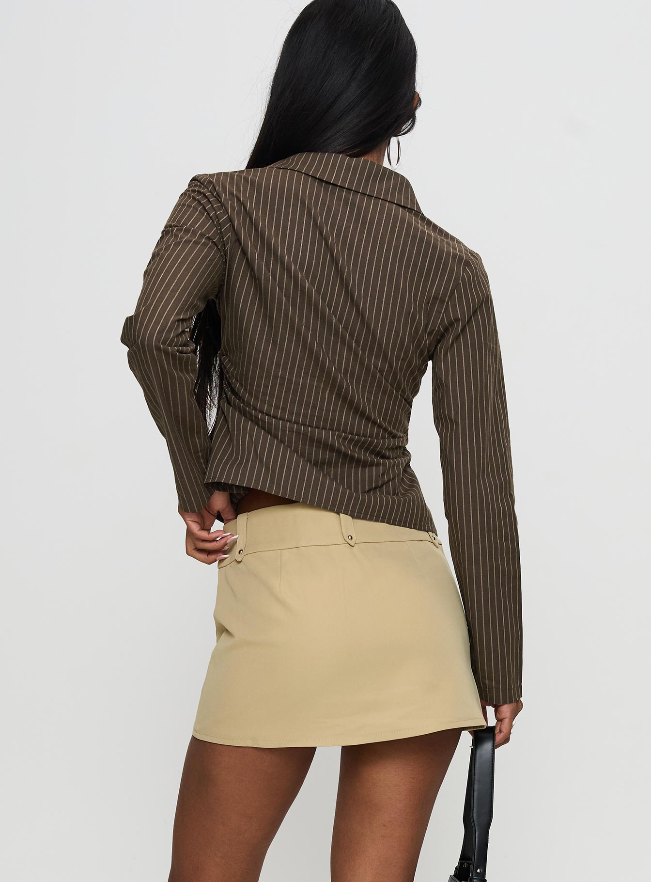 back view of model wearing Princess Polly Caitlan Mini Skirt Beige Mini Skirts 