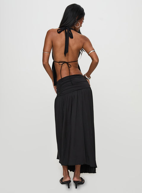 back view of model wearing Princess Polly Gezabele Asymmetrical Maxi Skirt Black Maxi 