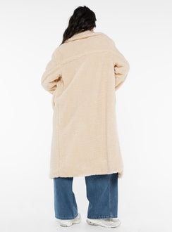 Long teddy coat Lapel collar, button fastening at front, twin hip pockets