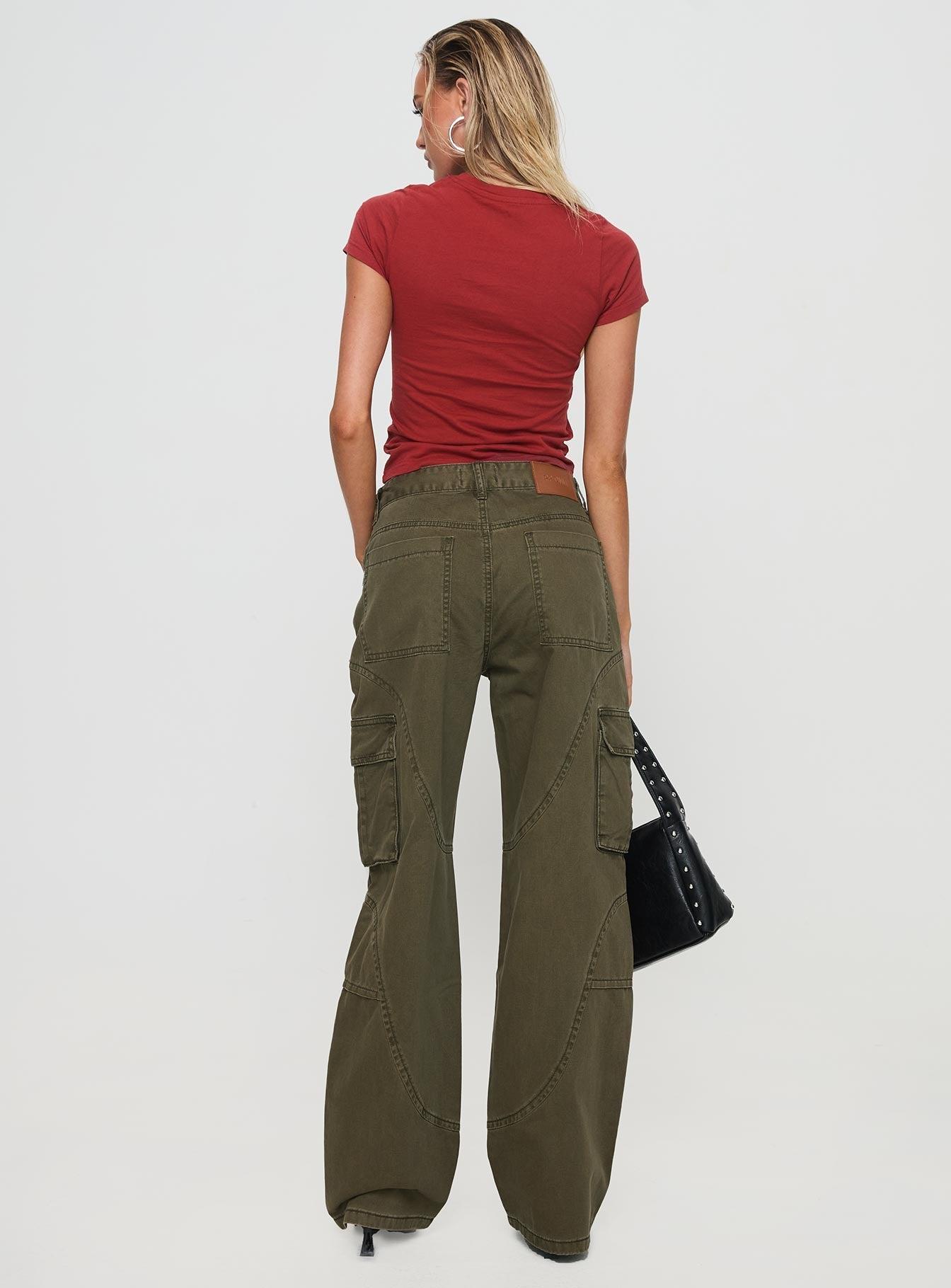 back view of model wearing Princess Polly Ahstin Cargo Jeans Green Low Rise Jeans 