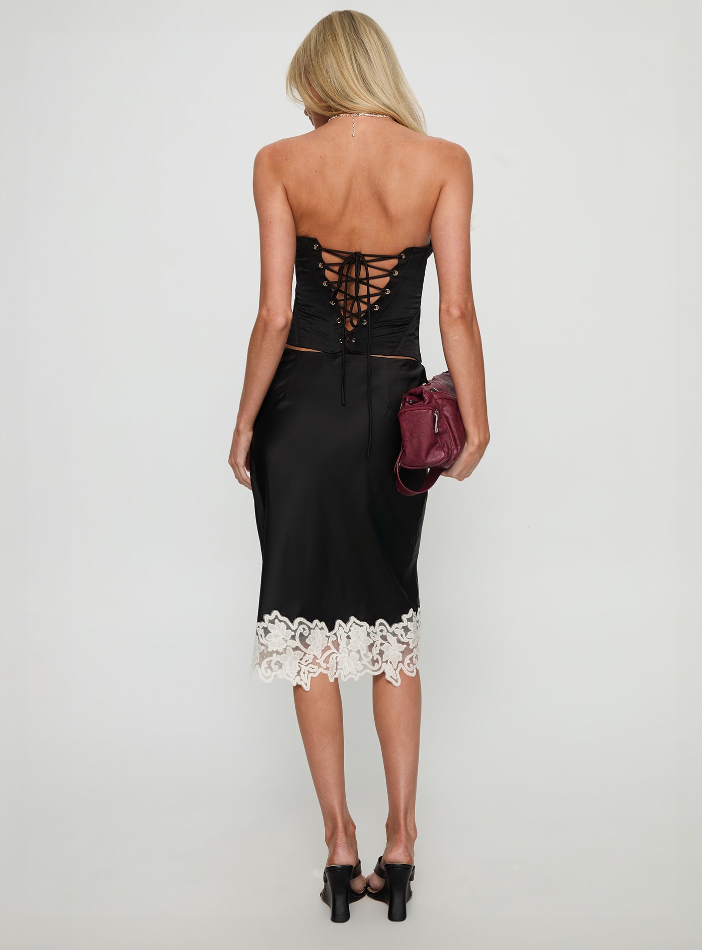 back view of model wearing Princess Polly Anchored Midi Skirt Noir Midi Skirts 