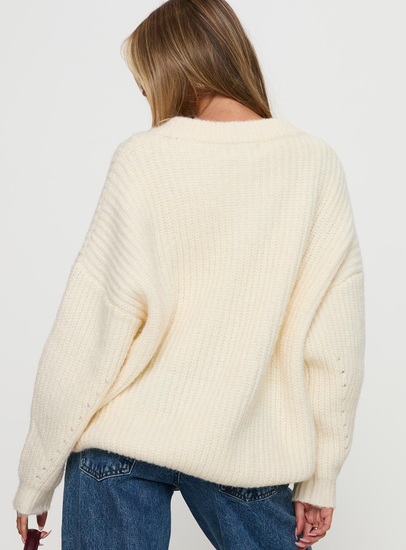 back view of model wearing Princess Polly Have It All V Neck Knit Sweater Cream Long 