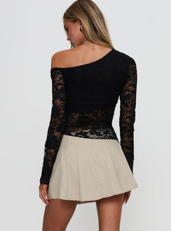 back view of model wearing Princess Polly Khaite Pleated Mini Skirt Beige Mini Skirts 