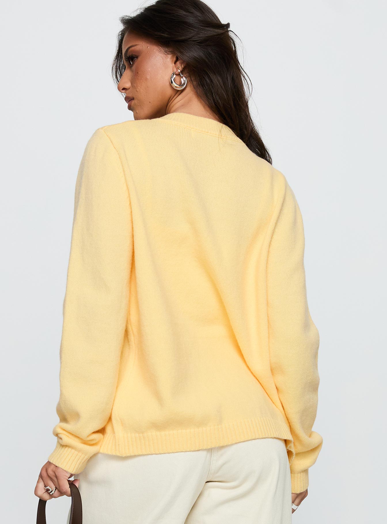 back view of model wearing Princess Polly Arica Button Up Knit Cardigan Lemon Long 
