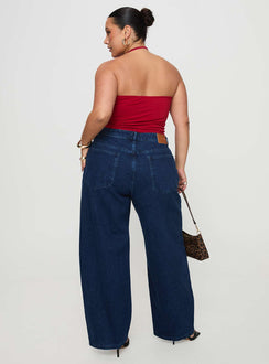 back view of model wearing Princess Polly Britta Mid Rise Tapered Leg Jeans Dark Wash Curve High Waisted 