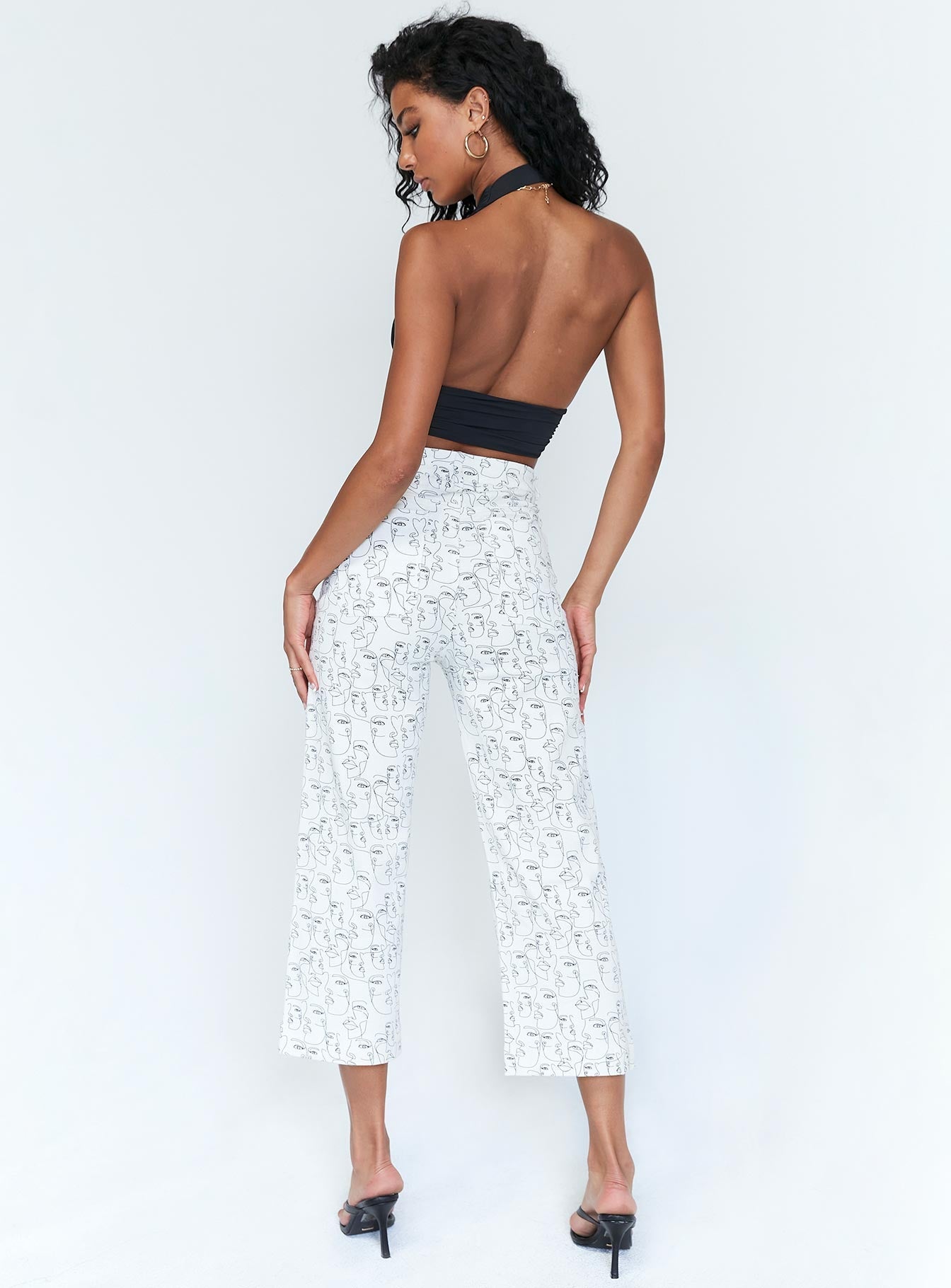 back view of model wearing Princess Polly Nelly Wide Leg Face Print Pants White 