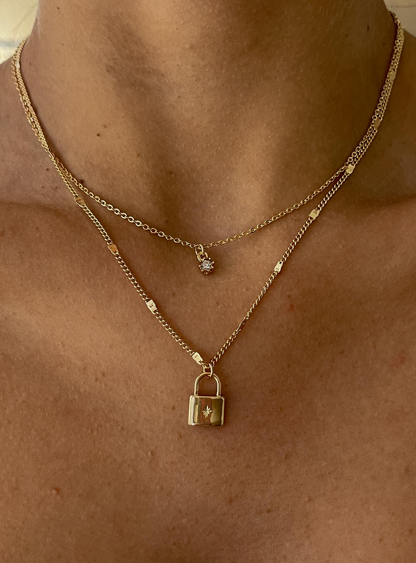 Gold Necklace Pack of two  Fixed design - these can not be wrong separately  Dainty gold-toned chain  Padlock pendant  Lobster clasp fastening 